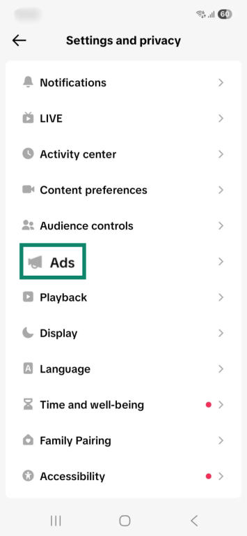 The "Settings and privacy" settings menu in the TikTok app. The "Ads" option is enlarged and highlighted.