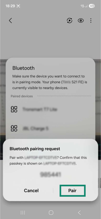 A Bluetooth pairing request on an Android phone. The "Pair" button is highlighted.